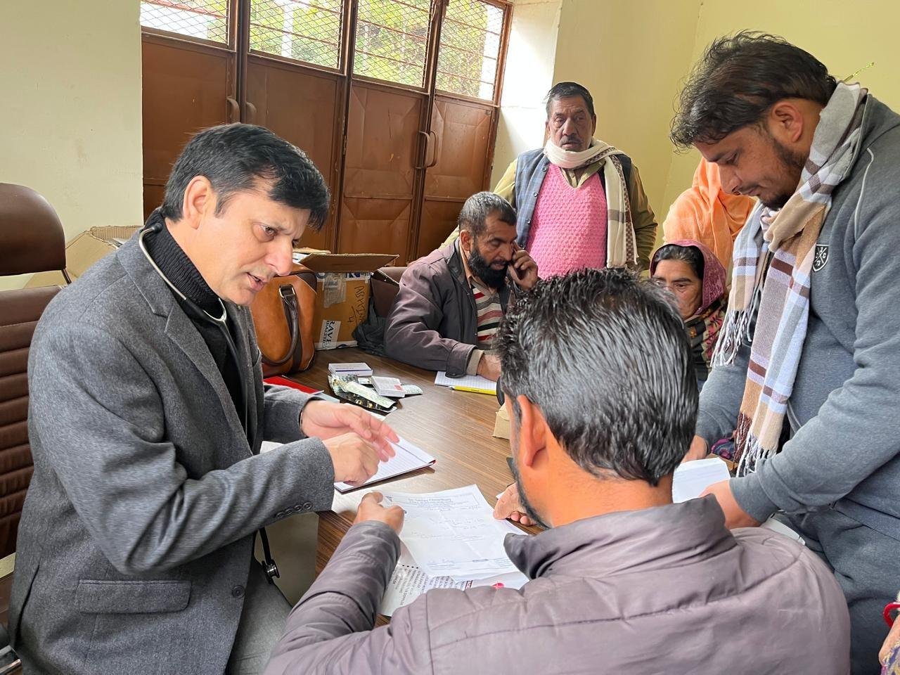 Dr. Ishfaq Chowdhary explaining a prescription