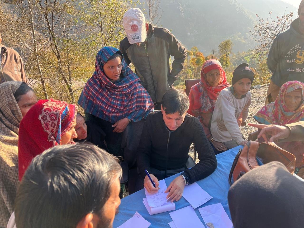 Dr. Ishfaq Chowdhary writing a prescription
